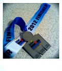 This finisher medal will always be my "number 13" - weighted with much more than an Ironman finish!